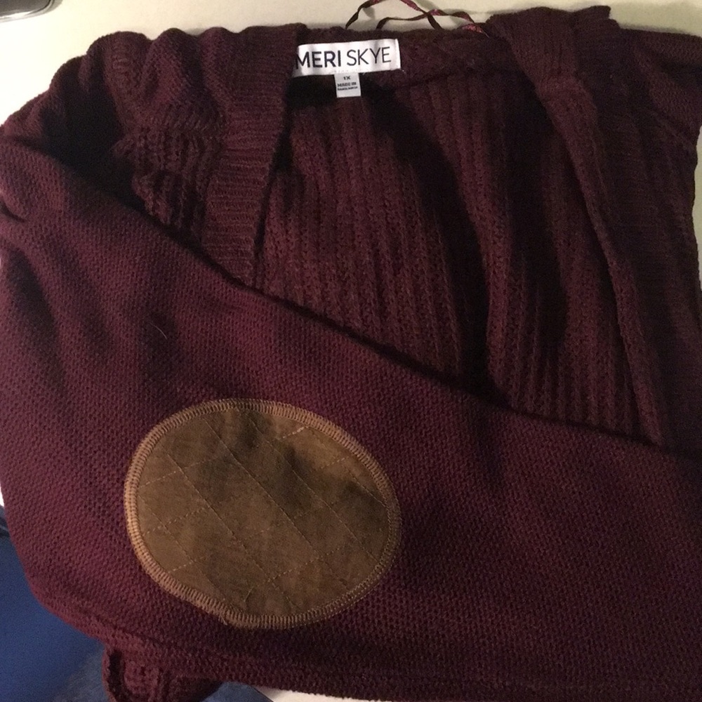 Burgundy cardigan with light brown leather elbows